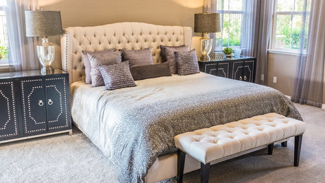 Calm neutral bedroom with soft bedding and natural light for a steady sleep-foundation guide