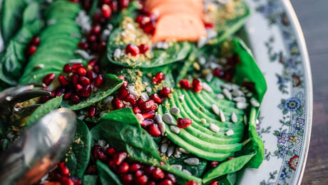 Fresh whole foods and botanical ingredients arranged on a bright table for a ginger supplement label guide