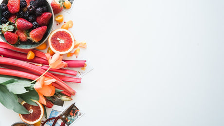 Text-free overhead view of fresh colorful produce on a bright kitchen surface for a B vitamin label guide